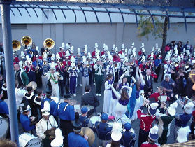 high school marching band tuning up for their on field performance.